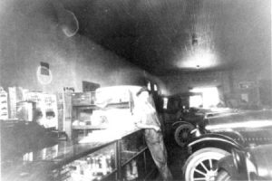 This photo shows Albert Schaper in his new business with some of his new Chevrolets. The old original ceiling seen reflecting in the photo can still be seen in our store.